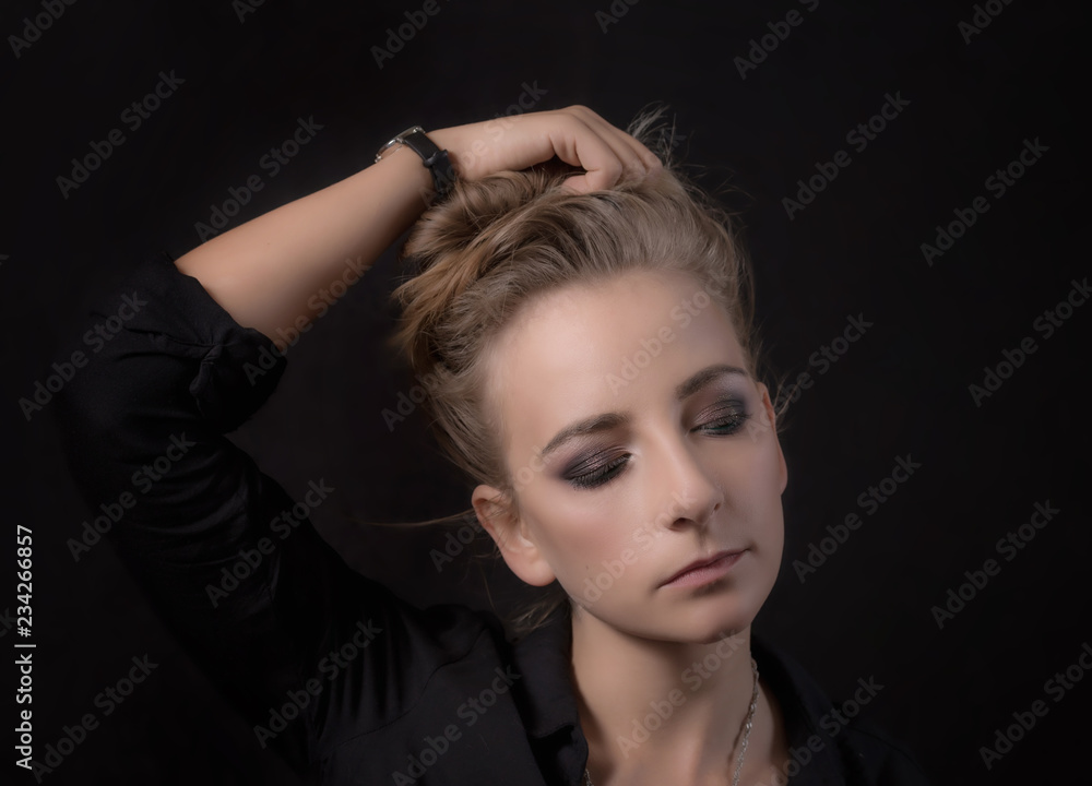 Portrait of a young woman on a black background Portrait of a young woman on a black background