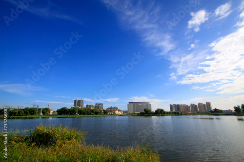 city scenery, buildings stand beside the river