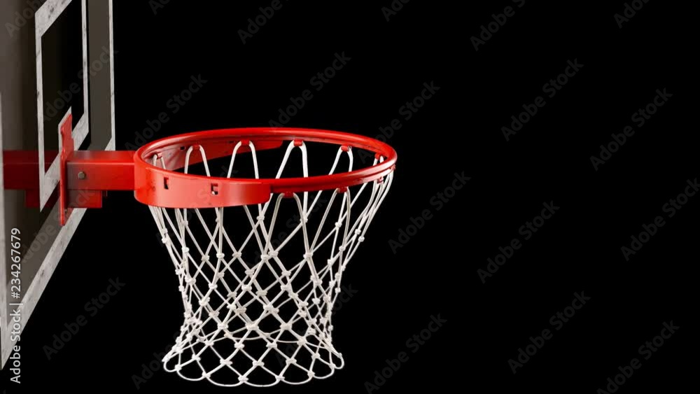 A throw basketball ball in a ring on a black background A throw basketball ball in a ring on a black background