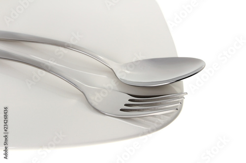 Spoon and fork with plate