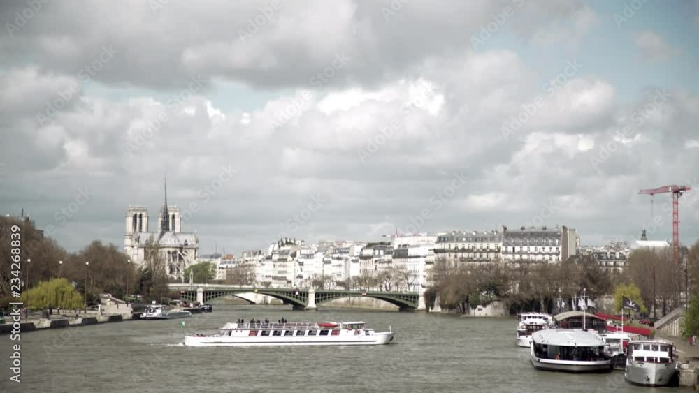 Notre Dame and the Seine wide establishing shot Notre Dame and the Seine wide establishing shot