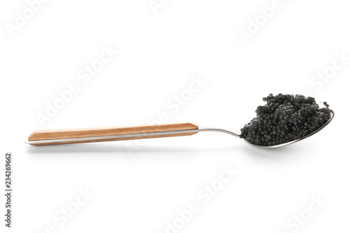 Spoon with delicious black caviar on white background