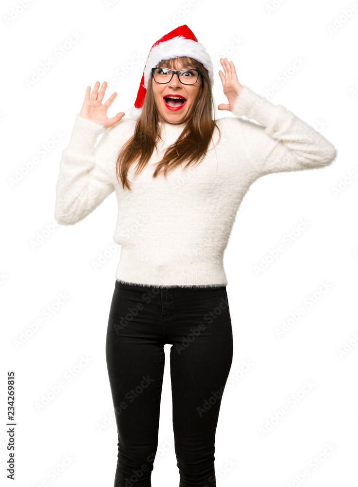 Girl with celebrating the christmas holidays with surprise and shocked facial expression on isolated white background Girl with celebrating the christmas holidays with surprise and shocked facial expression on isolated white background