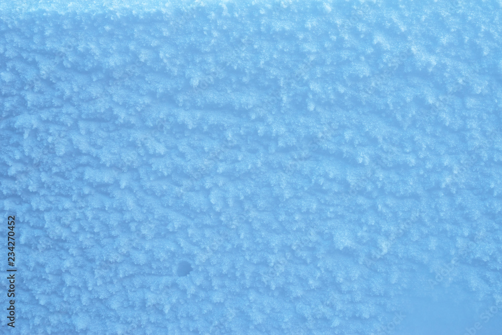 Macro shot of blue snow texture.