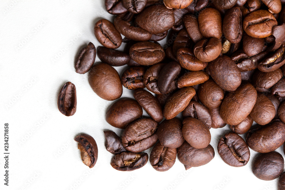 Roasted coffee beans isolated on a white background. Roasted coffee beans isolated on a white background.
