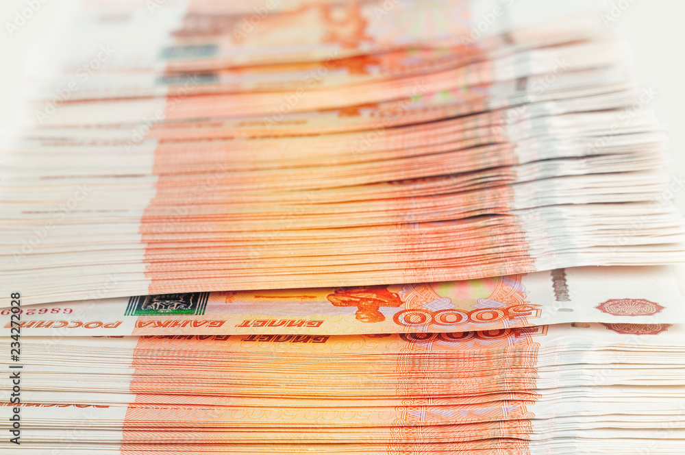 Million Russian rubles. The concept of wealth, profits, business and finance. Stack money in the five thousandth bills banknotes. A lots wads of money, many cash Million Russian rubles. The concept of wealth, profits, business and finance. Stack money in the five thousandth bills banknotes. A lots wads of money, many cash