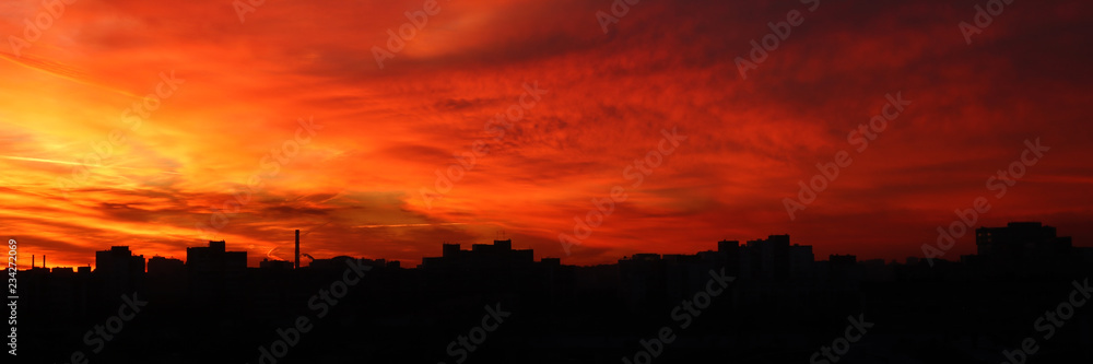Beautiful bright red sunset over the city