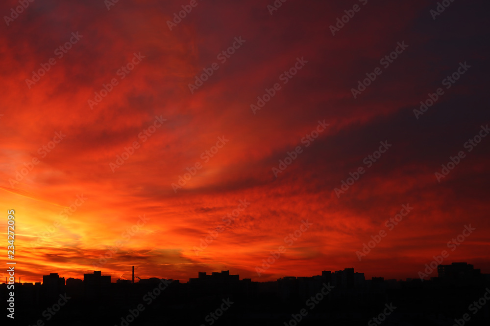 Beautiful bright red sunset over the city Beautiful bright red sunset over the city