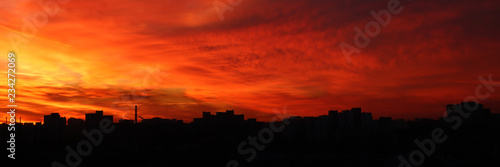 Beautiful bright red sunset over the city © makedonski2015