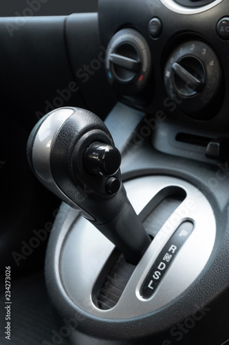 Car gearbox lever in driver place.