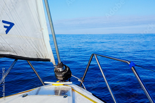 calm see and beautiful seascape from a sailboat while crossing the english channel photo