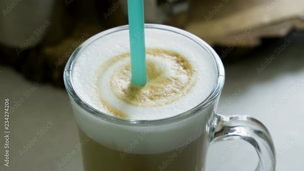 Latte. Close-up shot of a glass of coffee with a milk. 4K Latte. Close-up shot of a glass of coffee with a milk. 4K