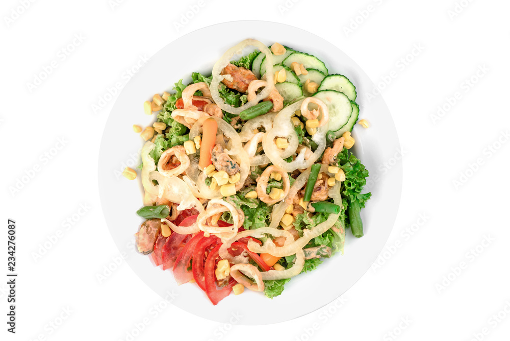 Salad with mussels, squid, bell pepper, tomatoes, corn, cucumbers and asparagus in a white plate isolated on white background. top view. flat lay Salad with mussels, squid, bell pepper, tomatoes, corn, cucumbers and asparagus in a white plate isolated on white background. top view. flat lay