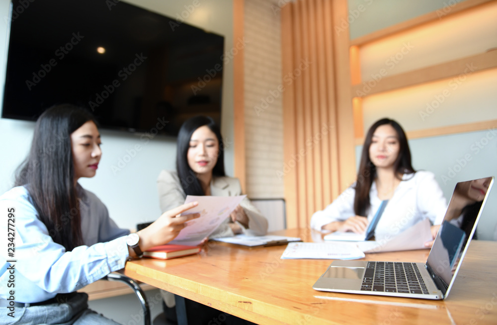 Three working women are meeting in office. Three working women are meeting in office.