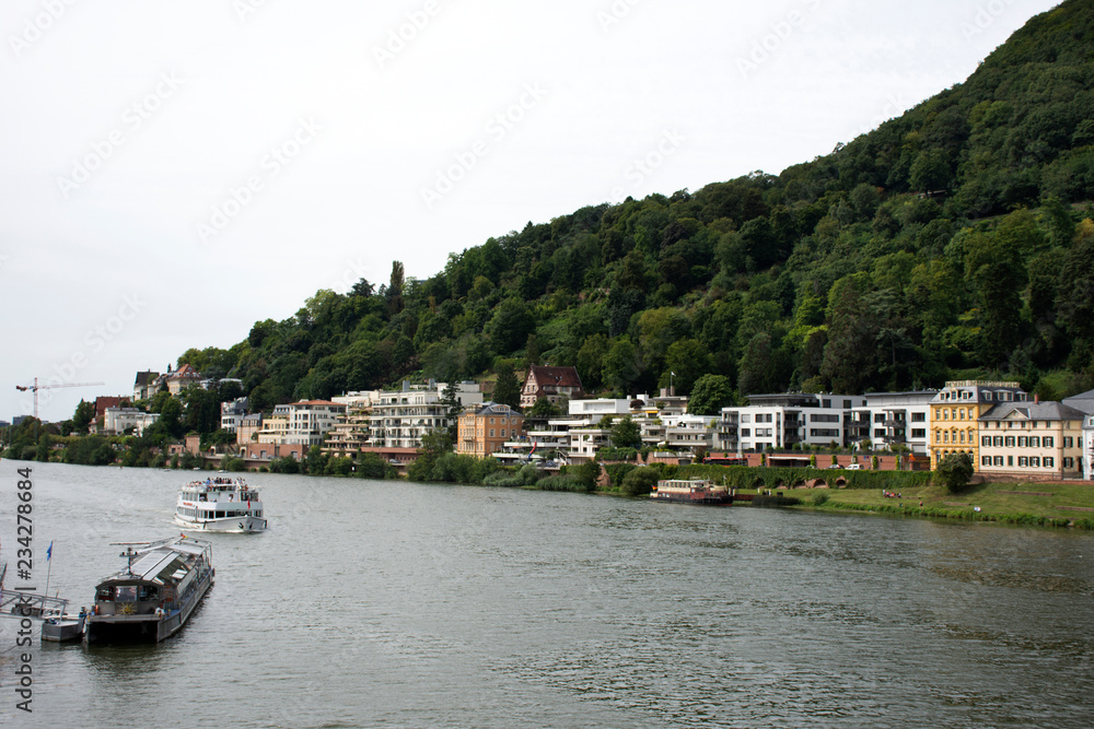 Cruises riding in Rhine and Neckar river bring passengers visit and looking Heidelberg old town, Germany