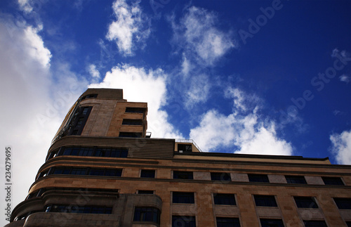 Building and blue sky with white clouds