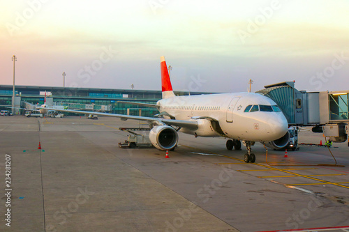 Planes preparing for take off, waiting for passengers and loading 