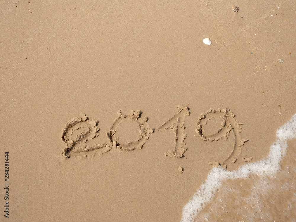 Fototapeta premium Sand written numbers on beach