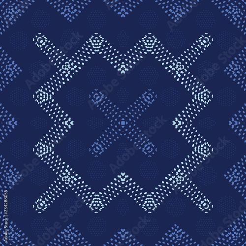 Decorative seamless vector pattern with shapes created from hand drawn dots. Creates an abstract look with tribal appeal for textile, fashion, quilting, wallpaper, home decor and graphic design work.