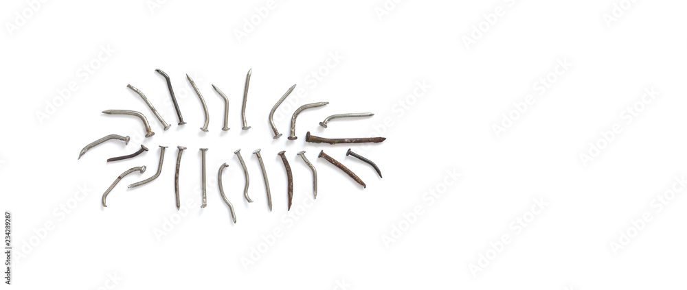 Deformed used metal nails on a white background. close-up photo, copy space