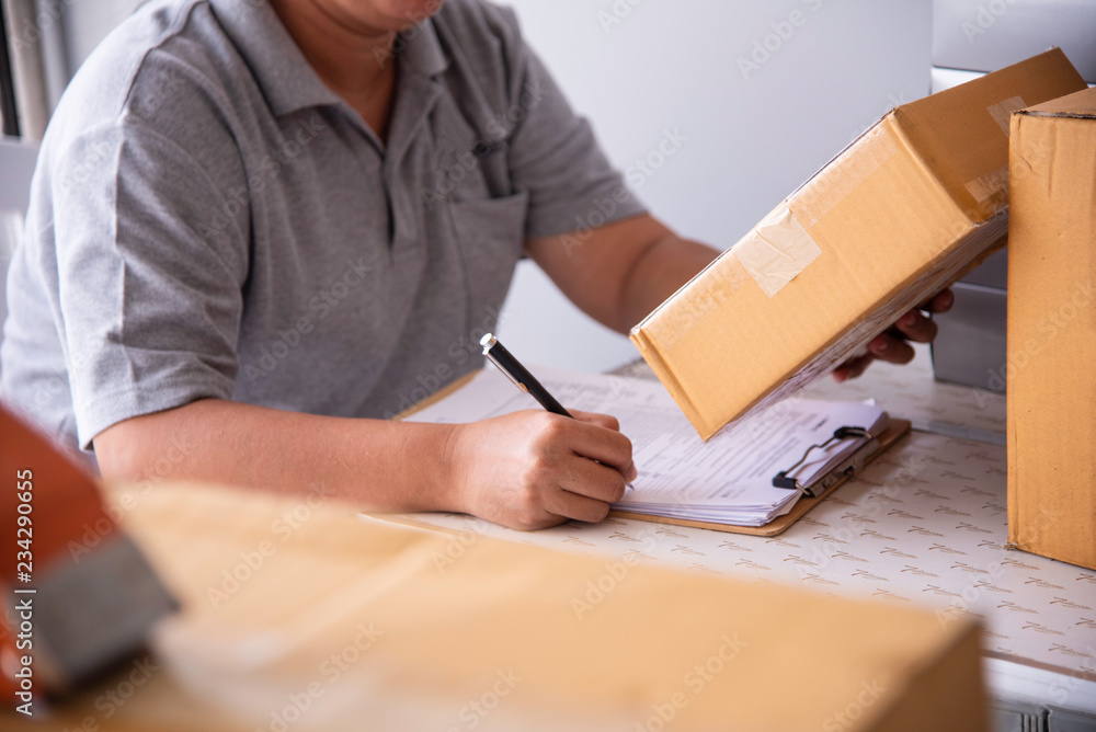 Shipping staff are checking the product before shipping to the customer. Shipping staff are checking the product before shipping to the customer.