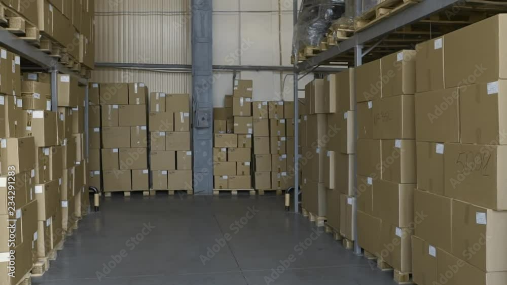 Cardboard Boxes on shelves Inside Storage. Warehouse complex. Logistics Terminal. Industrial indoor warehouse Interior with boxes. Cardboard Boxes on shelves Inside Storage. Warehouse complex. Logistics Terminal. Industrial indoor warehouse Interior with boxes.