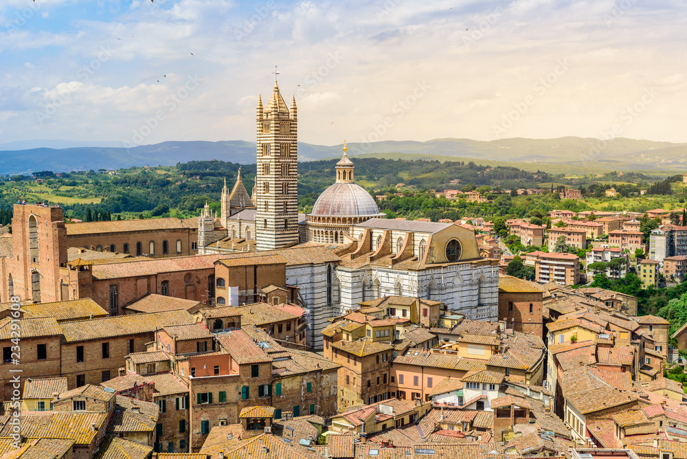 Historic town Siena, Tuscany - Aerial view with beautiful landscape scenery on a sunny summer day, walled medieval hill town with towers in the province of Siena, Italy- Europe