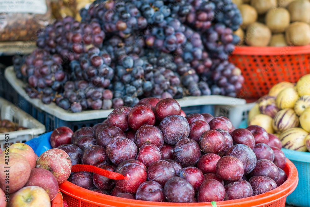 Different fruits on a local market of Sapa in the north of Vietnam Different fruits on a local market of Sapa in the north of Vietnam