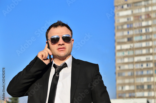 Businessman Using Mobile © Zlajs
