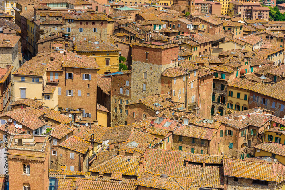 Historic town Siena, Tuscany - Aerial view with beautiful landscape scenery on a sunny summer day, walled medieval hill town with towers in the province of Siena, Italy- Europe