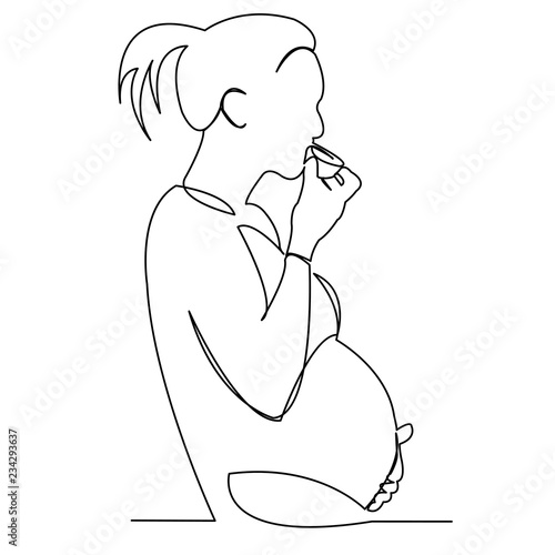 pregnant woman eating cake