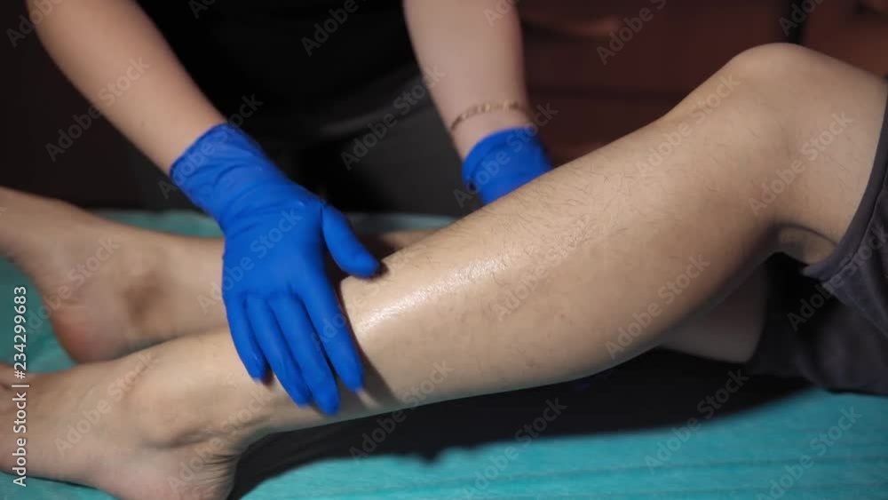 custom made wallpaper toronto digitalThe cosmetologist applies a special cream on the female leg of the client before epilation with a thick sugar paste, dolly shot.