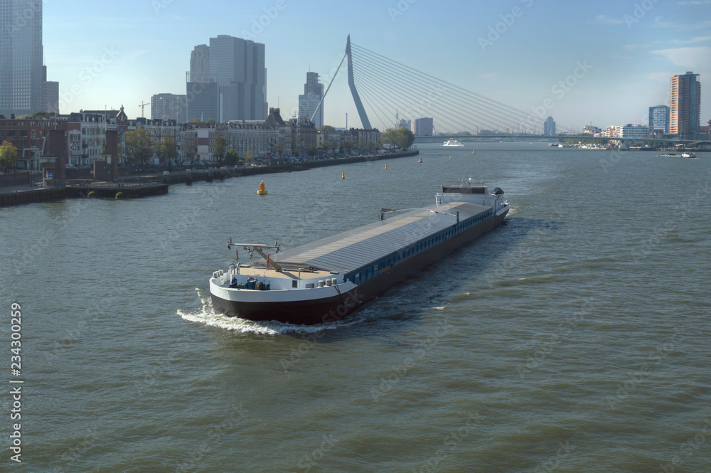 Barge with cityscape of Rotterdam