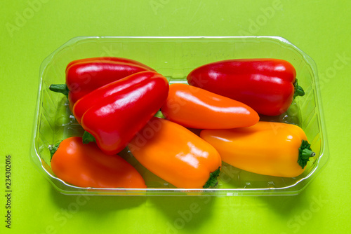 Group of mini paprica, red, yellow and orange in plastic package