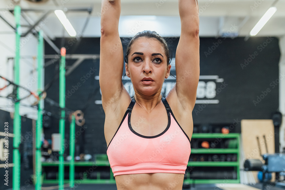 Fototapeta premium young woman training indoor crossfit gym - sportive, training, healthy lifestyle concept