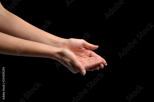 female hands holding something in a handful. Isolated