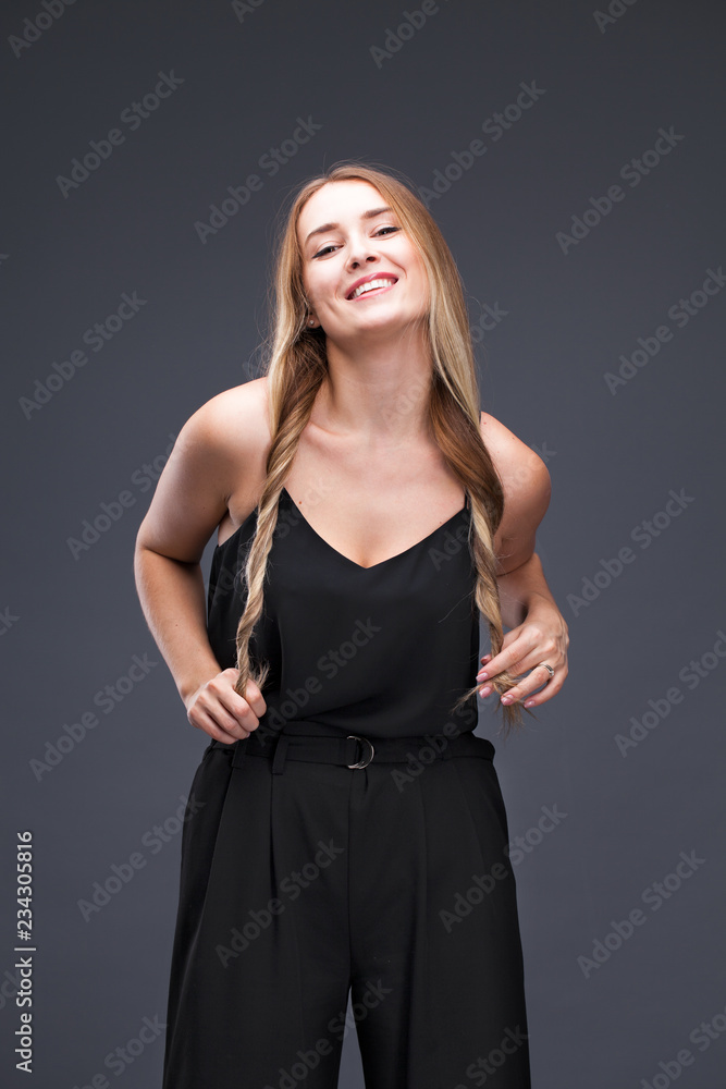 Beautiful blonde woman in black dress Beautiful blonde woman in black dress