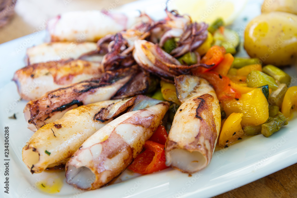 Mediterranean Octopus with vegetables and potatoes Mediterranean Octopus with vegetables and potatoes