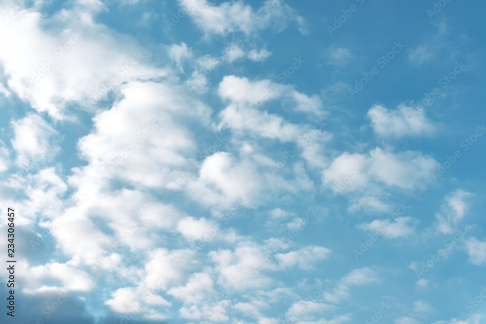 beautiful white clouds on a bright blue sky on a warm summer day beautiful white clouds on a bright blue sky on a warm summer day