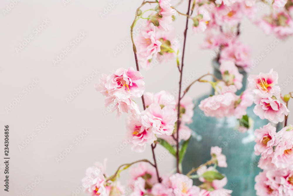 Vase with cherry blossom background texture close-up