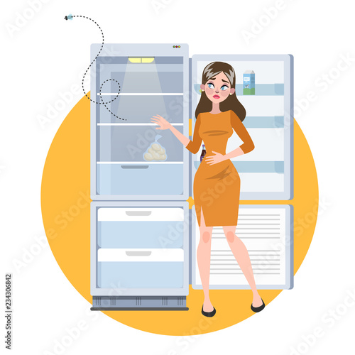 Woman standing at the opened empty fridge