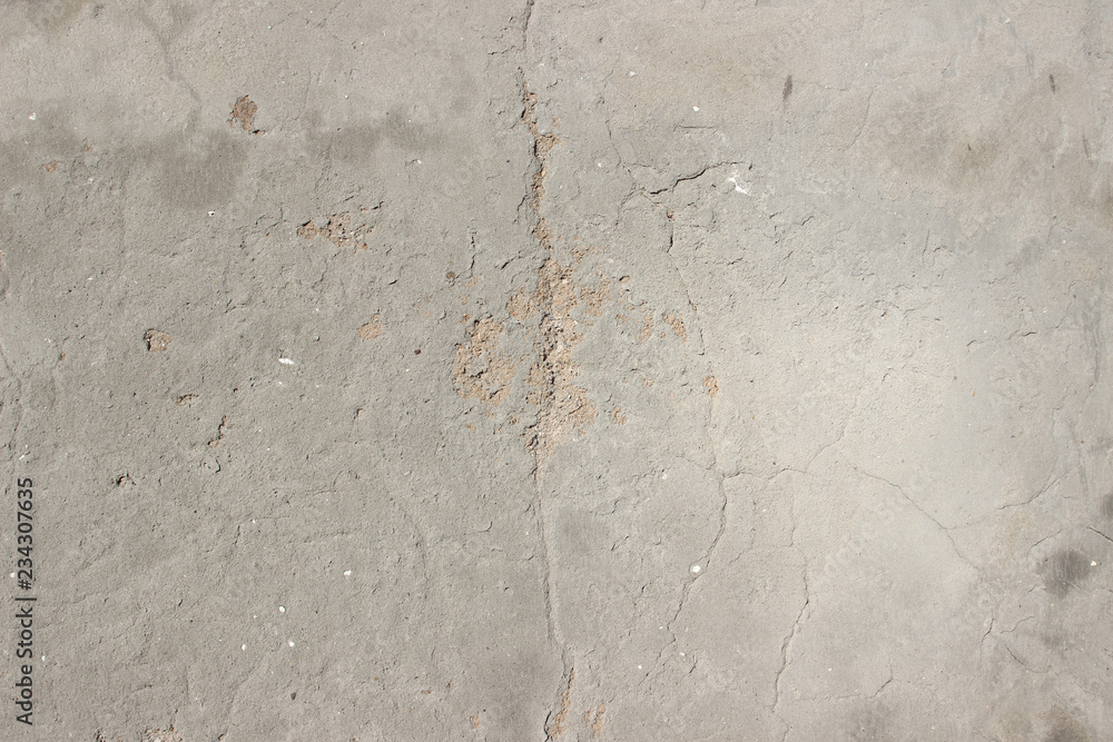 Concrete plaster cement wall with stains markings cracks detail close up Concrete plaster cement wall with stains markings cracks detail close up