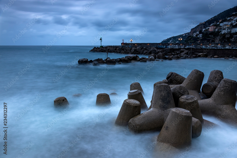 The storm surge barrier breakwater in Amalfi, Italy. Long exposure The storm surge barrier breakwater in Amalfi, Italy. Long exposure