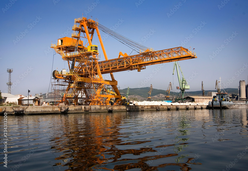 A shot of a yellow ship crane