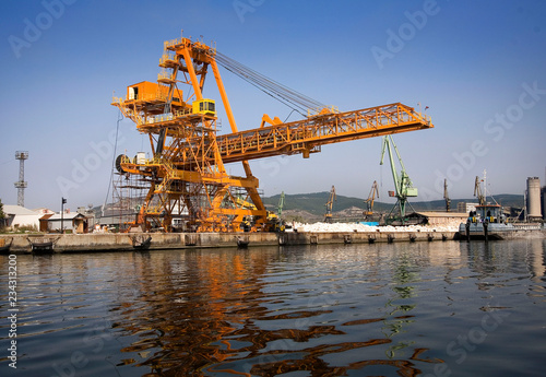 A shot of a yellow ship crane