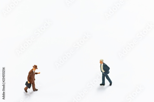 Selective focus miniature business people activity on white background with copy space.