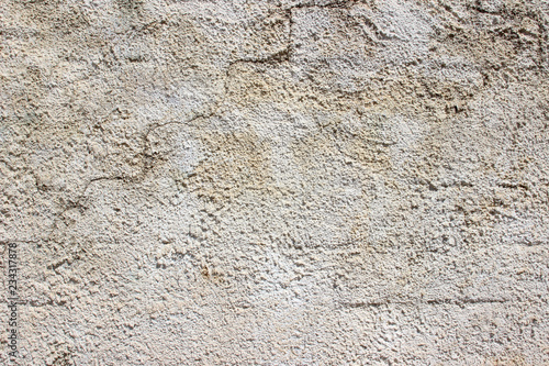 Old white grey gray plaster stucco wall outer weathered stained detail close up