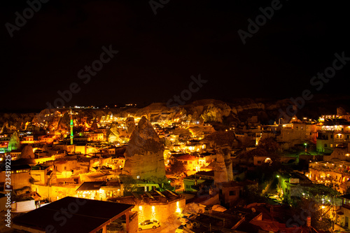 Illuminated city at night, Cappadocia, Goreme. Most famous and popular place in Turkey