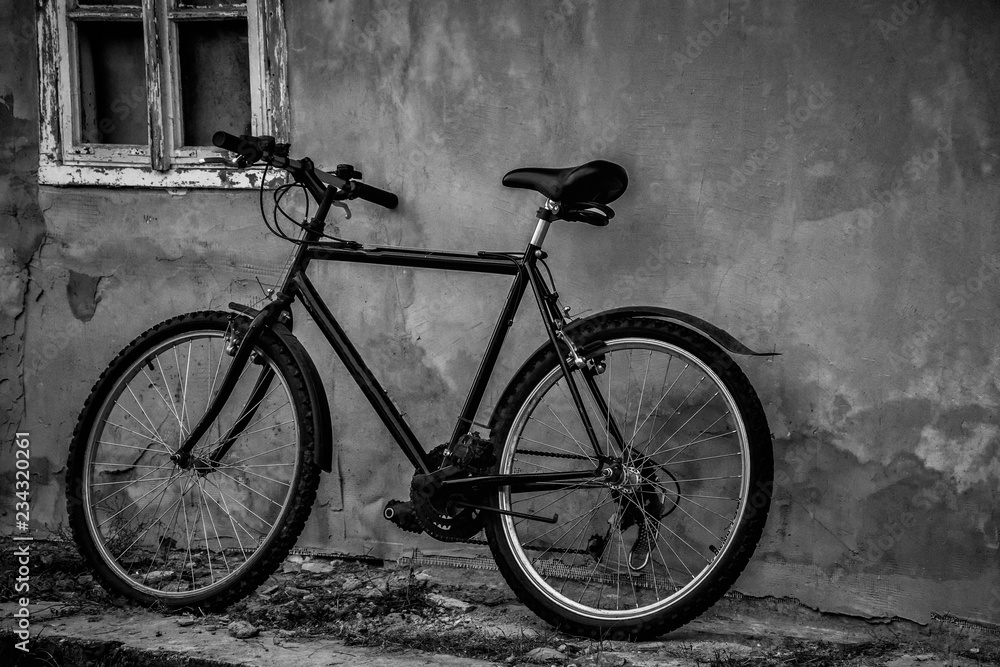 Black bicycle parking at the old house in black and white. Black bicycle parking at the old house in black and white.