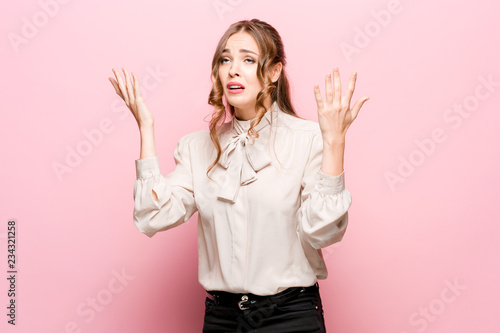 фотографія Portrait of displeased upset female frowns face as going to cry, being discontent and unhappy as cant achieve goals, isolated over pink studio background